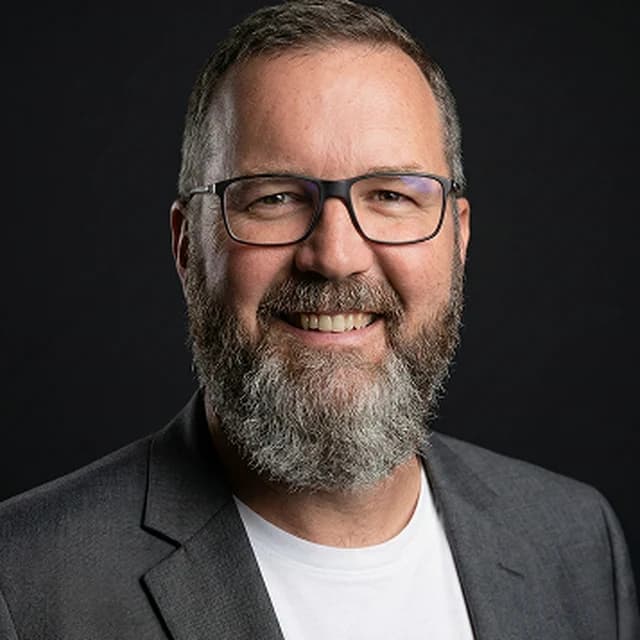 Studio portrait of Greg Steiniger